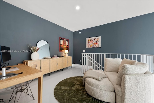 interior space featuring recessed lighting, an upstairs landing, and baseboards