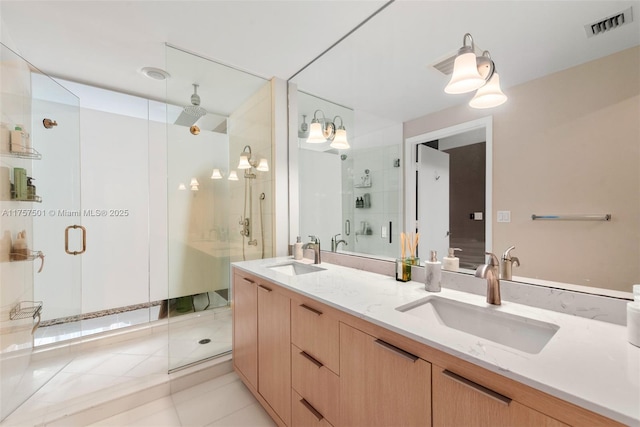 bathroom with a stall shower, visible vents, a sink, and double vanity