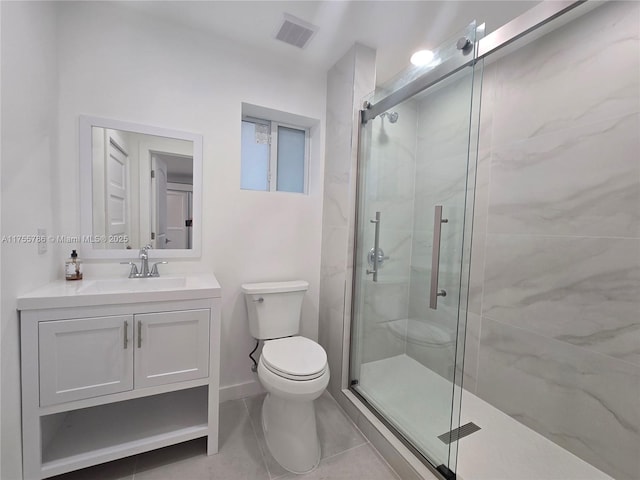 bathroom featuring visible vents, toilet, vanity, and a marble finish shower