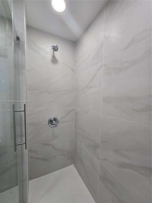 bathroom featuring a stall shower