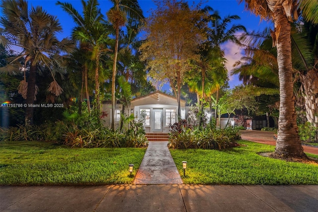 view of front of home with a front yard