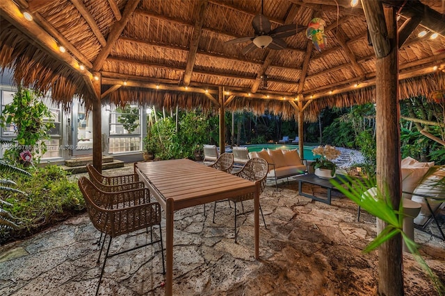 view of patio / terrace with a gazebo and an outdoor pool