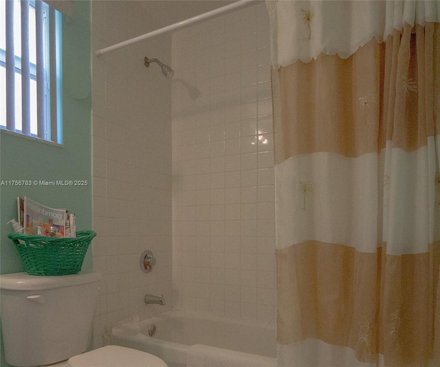 full bathroom with shower / tub combo with curtain and toilet