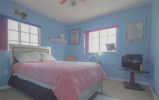 bedroom featuring ceiling fan, carpet floors, and baseboards