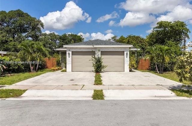 garage with concrete driveway