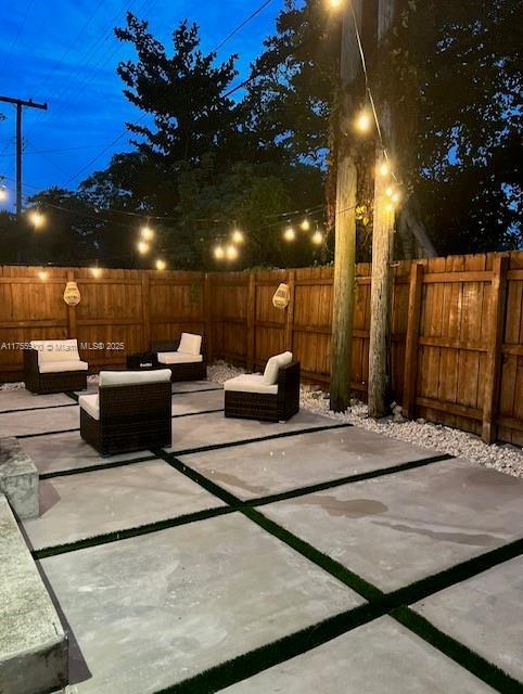 view of patio with a fenced backyard and an outdoor living space