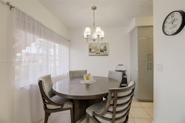 800 SW 11th Ave Unit 9A, Hallandale Beach, FL 33009 - dining area with an inviting chandelier, light tile patterned floors, and a textured ceiling