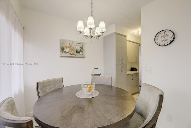 dining room featuring a notable chandelier