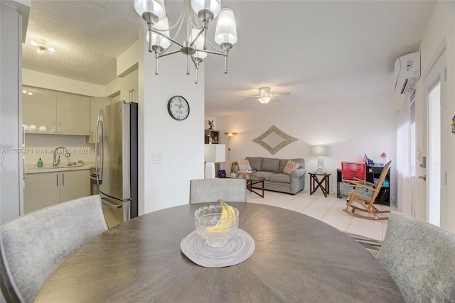 dining space featuring light tile patterned floors, ceiling fan with notable chandelier, a textured ceiling, and a wall mounted air conditioner