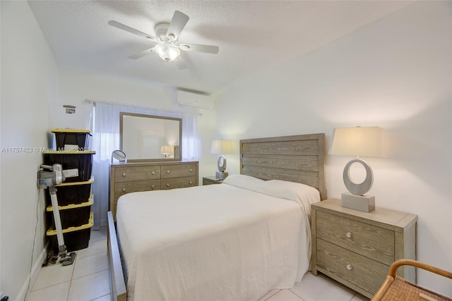 800 SW 11th Ave Unit 9A, Hallandale Beach, FL 33009 - bedroom featuring an AC wall unit, light tile patterned floors, a ceiling fan, and a textured ceiling