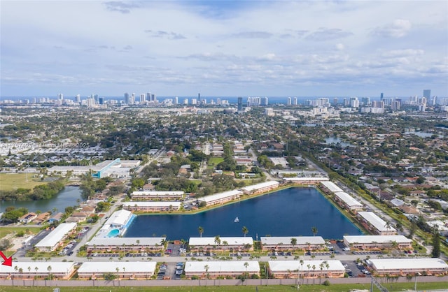 bird's eye view featuring a water view and a city view