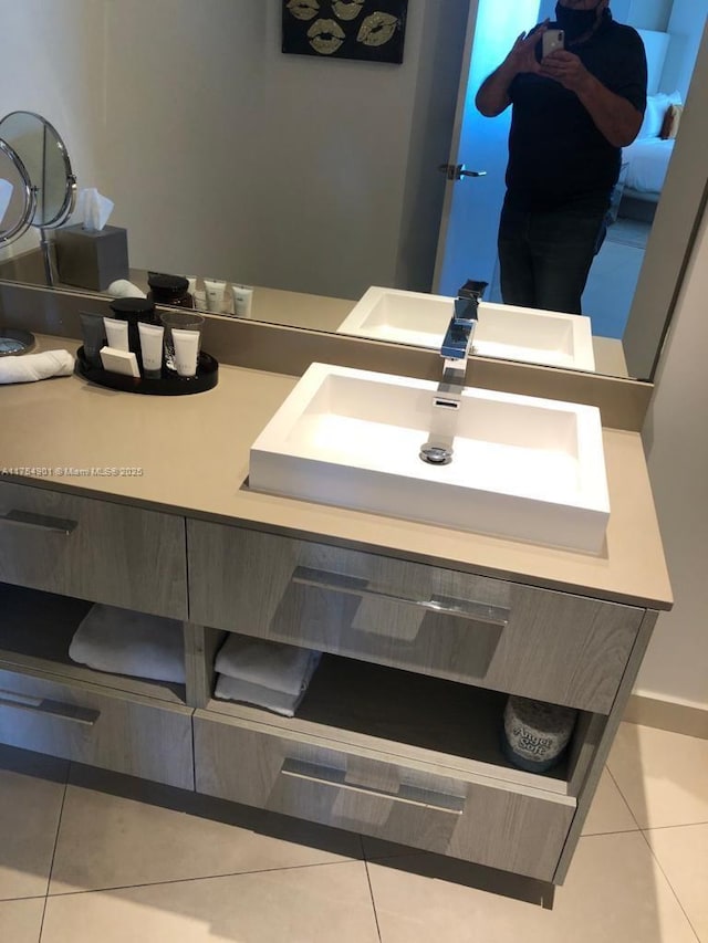 bathroom with tile patterned flooring and vanity