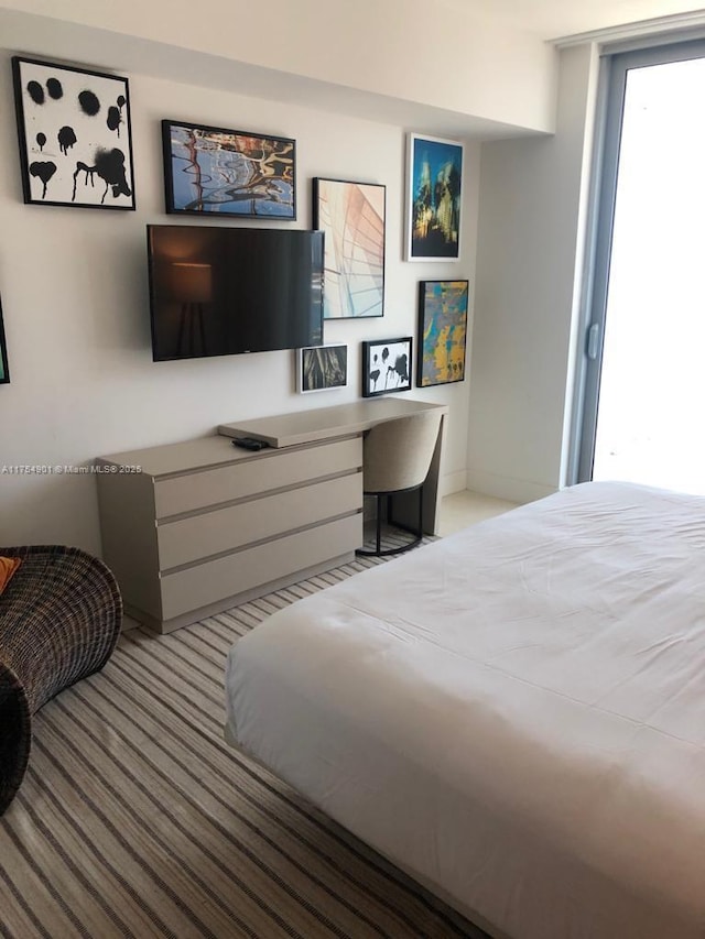 bedroom featuring carpet and built in study area