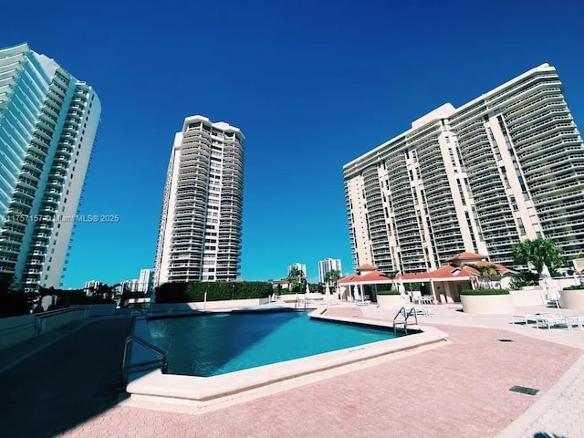 community pool featuring a patio area