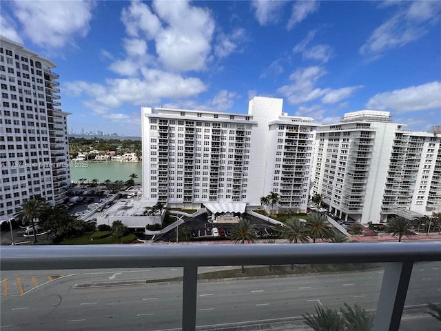 view of property with a water view and a view of city