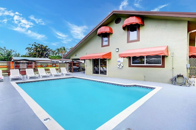 pool with a patio area