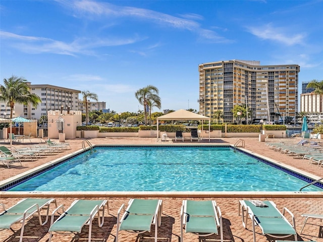 pool featuring a patio area and fence