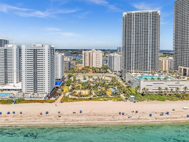 birds eye view of property with a view of city, a water view, and a view of the beach