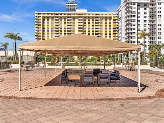 view of property's community with a gazebo and a patio area