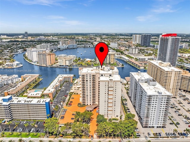 bird's eye view featuring a water view and a city view