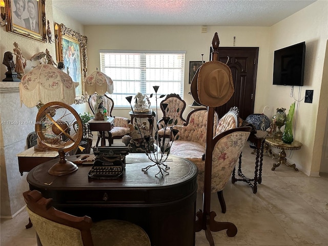 dining area featuring a textured ceiling