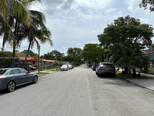 view of street with sidewalks and a residential view