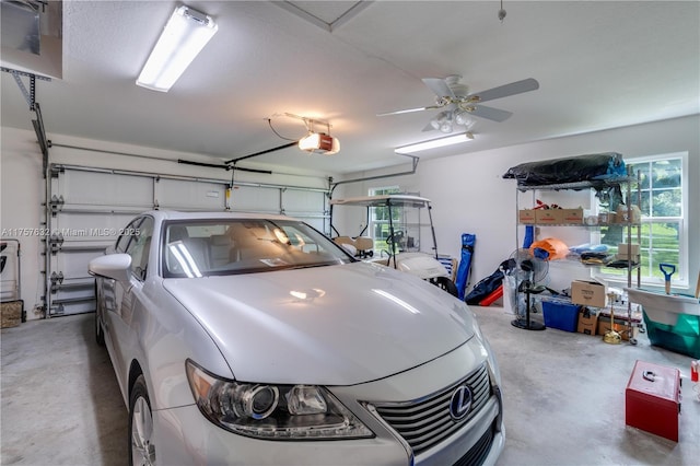 1132 Riverbend Dr, La Belle, FL 33935 - garage with ceiling fan and a garage door opener