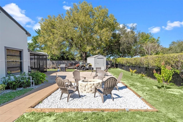 1222 Stardust Way, Royal Palm Beach, FL 33411 - view of patio / terrace with a storage unit, an outdoor fire pit, and an outbuilding