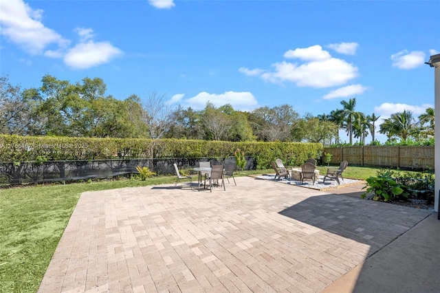 1222 Stardust Way, Royal Palm Beach, FL 33411 - view of patio / terrace featuring a fire pit