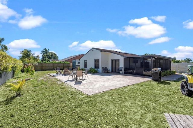 1222 Stardust Way, Royal Palm Beach, FL 33411 - back of property featuring a sunroom, a yard, and a fenced backyard