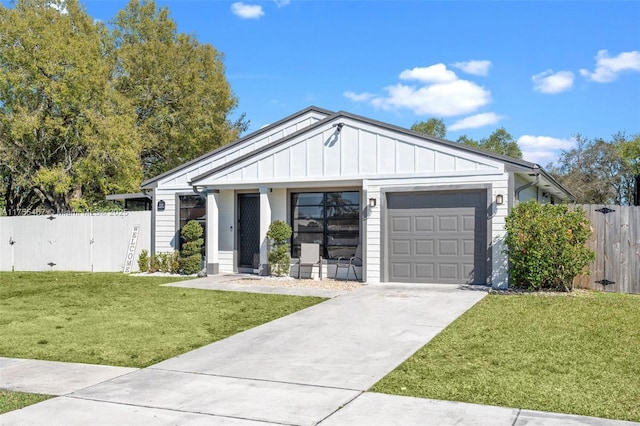 1222 Stardust Way, Royal Palm Beach, FL 33411 - view of front facade with fence, an attached garage, concrete driveway, a front yard, and board and batten siding