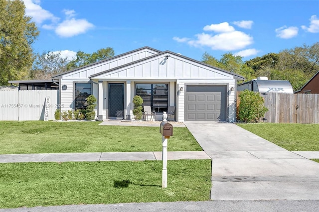 1222 Stardust Way, Royal Palm Beach, FL 33411 - view of front facade featuring fence, an attached garage, concrete driveway, a front lawn, and board and batten siding