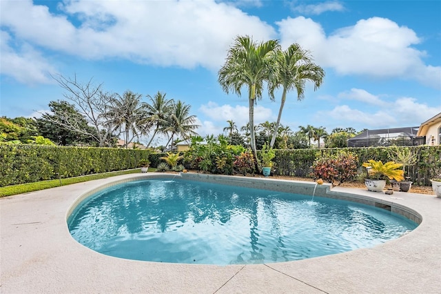 view of swimming pool featuring fence and a fenced in pool