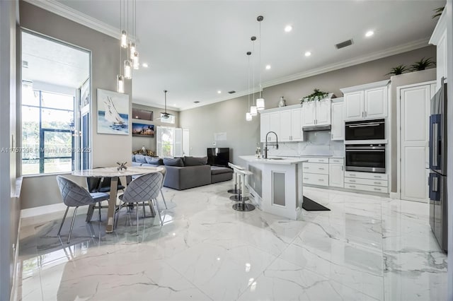 kitchen with visible vents, open floor plan, marble finish floor, black refrigerator with ice dispenser, and tasteful backsplash