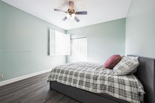 bedroom with a ceiling fan, dark wood finished floors, and baseboards