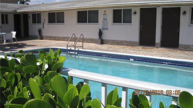 community pool featuring a patio