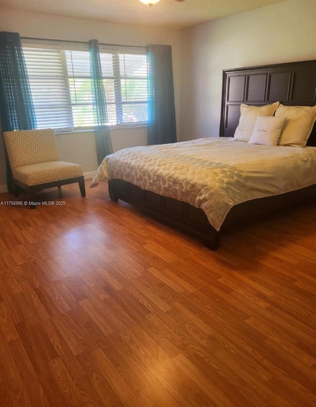 bedroom featuring wood finished floors