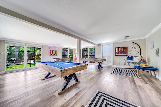 playroom featuring billiards, baseboards, ornamental molding, wood finished floors, and a textured ceiling