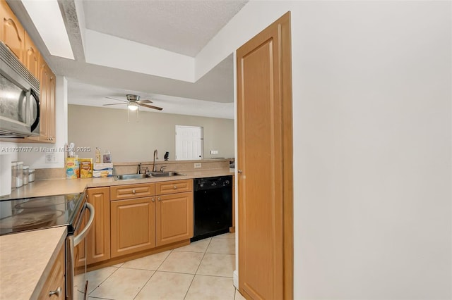 kitchen with light tile patterned floors, light countertops, stainless steel range with electric cooktop, a sink, and dishwasher