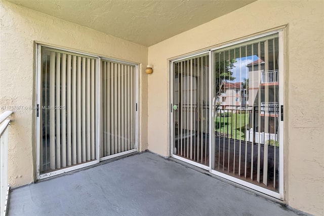 doorway to property with stucco siding