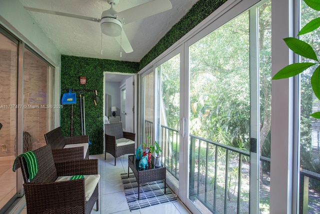 sunroom / solarium with ceiling fan