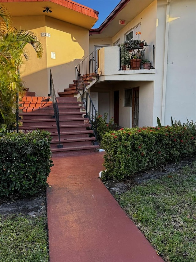 doorway to property with stucco siding