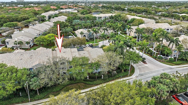 birds eye view of property with a residential view