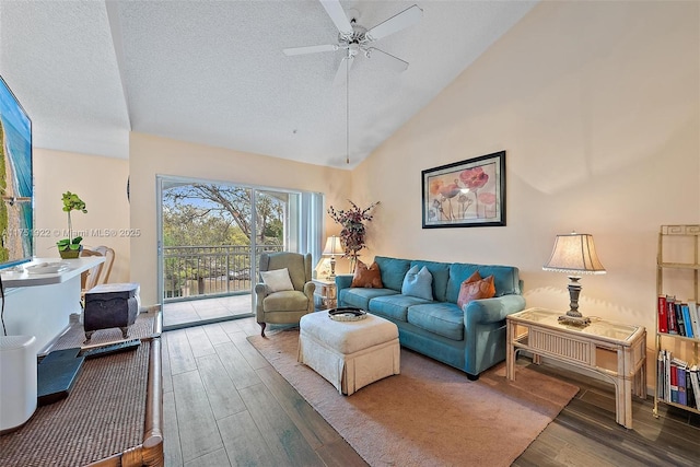 living room with a textured ceiling, ceiling fan, high vaulted ceiling, and wood finished floors