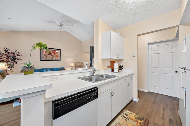 kitchen featuring white cabinets, dishwasher, a peninsula, light countertops, and a sink