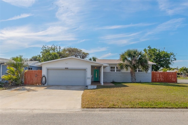 ranch-style home featuring a garage, fence, concrete driveway, and a front yard