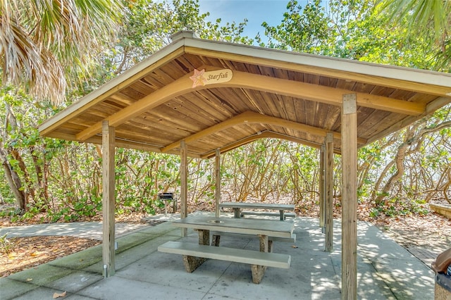view of community featuring a patio area and a carport