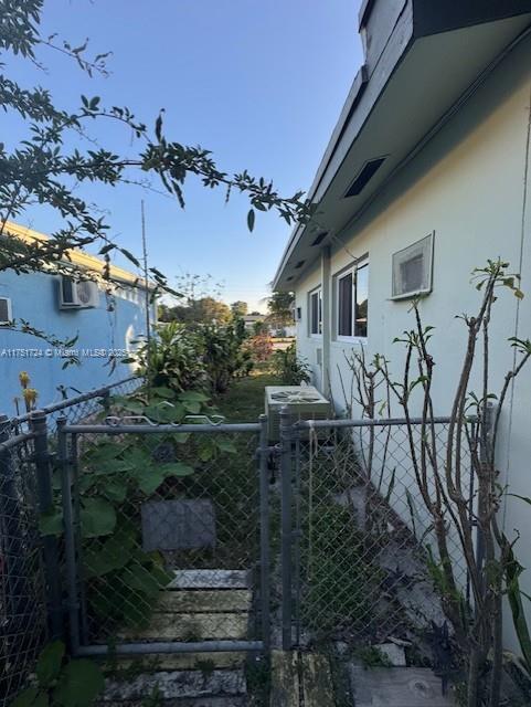 view of gate with fence