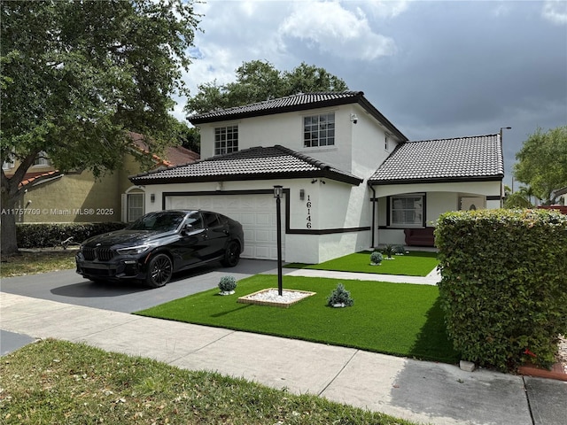 view of front of house with a front yard, driveway, a tiled roof, and stucco siding