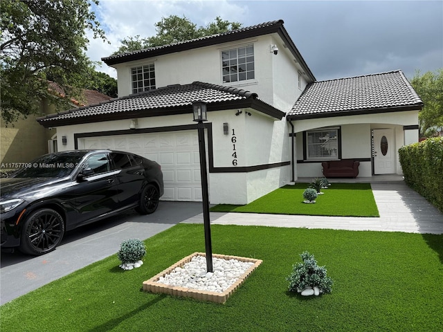 exterior space featuring a tile roof, stucco siding, concrete driveway, a front yard, and a garage